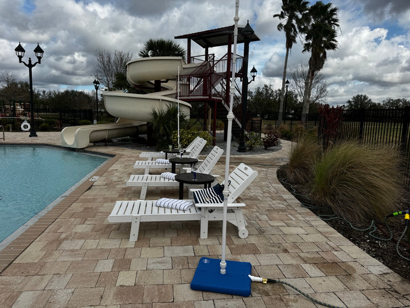 MR.PATIOMISTER set up beside a community pool with a water slide